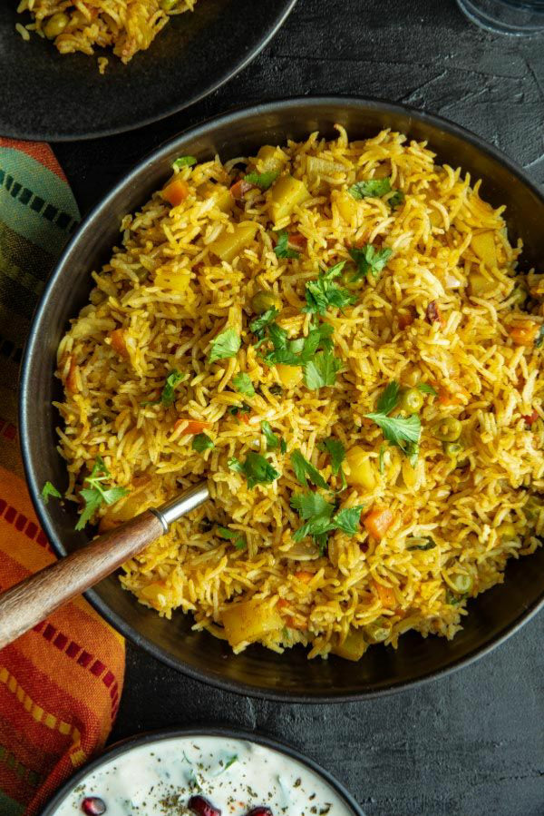 Lockdown Vegetable Biryani  with yoghurt Raita made of Cucumber, tomato and onions - portion for 1.